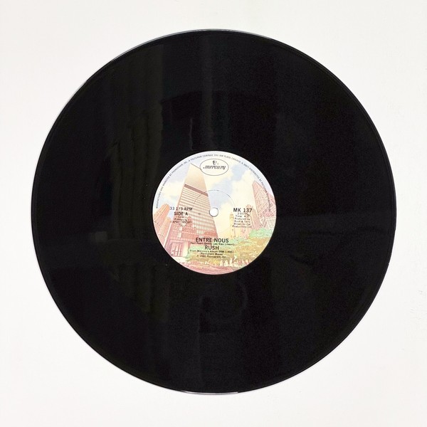 Front of the record Entre Nous by Rush