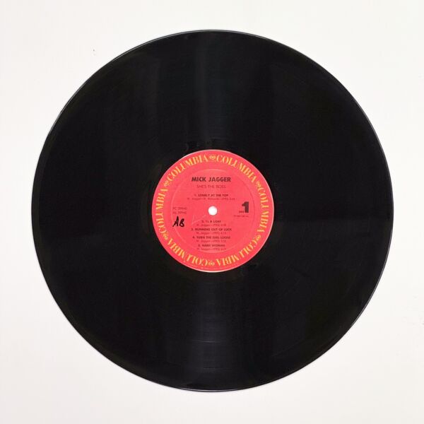 Front of the record She's the Boss by Jeff Beck, Pete Townshend, Mick Jagger, Robbie Shakespeare, Sly Dunbar, Jan Hammer, G.E. Smith