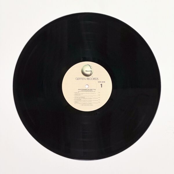 Front of the record Slide It In by Whitesnake