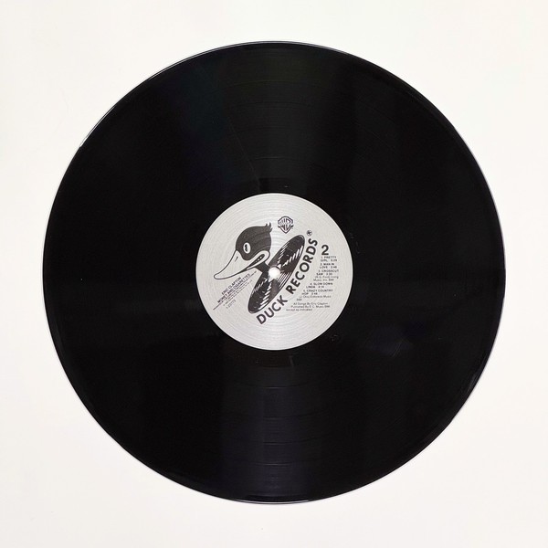 Back of the record Money And Cigarettes by Eric Clapton