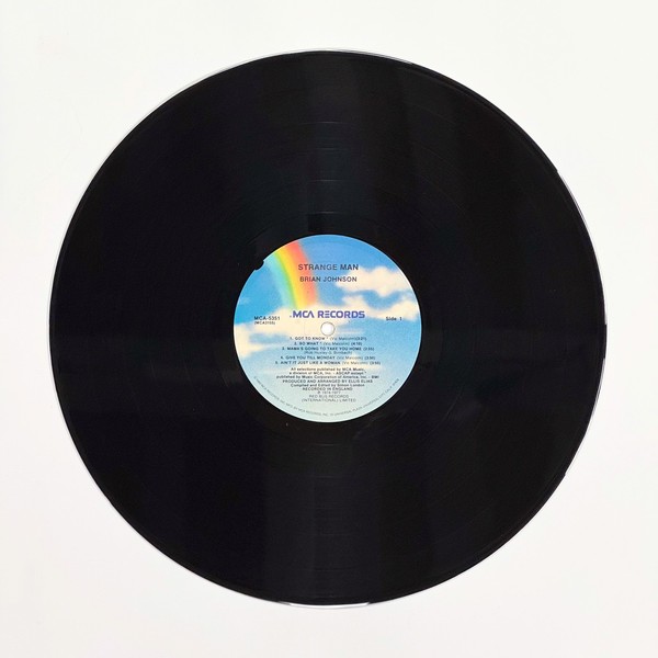 Front of the record Strange Man by Brian Johnson