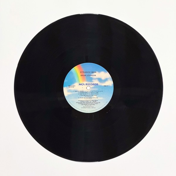 Back of the record Strange Man by Brian Johnson