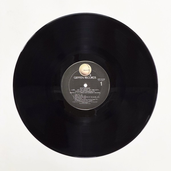 Front of the record Live... In The Heart Of The City by Whitesnake