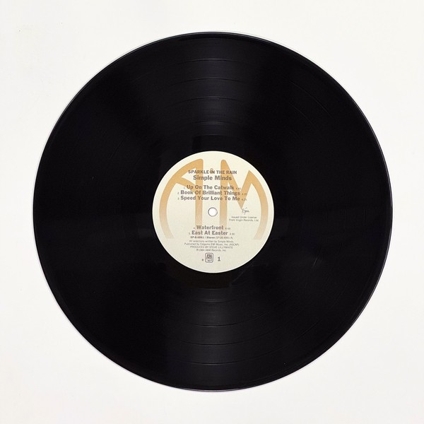 Front of the record Sparkle In The Rain by Simple Minds