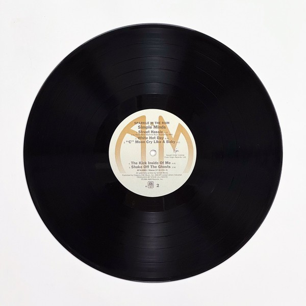 Back of the record Sparkle In The Rain by Simple Minds